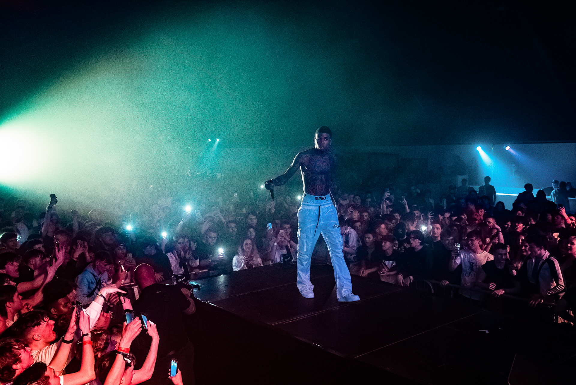 Artist on stage before a full crowd