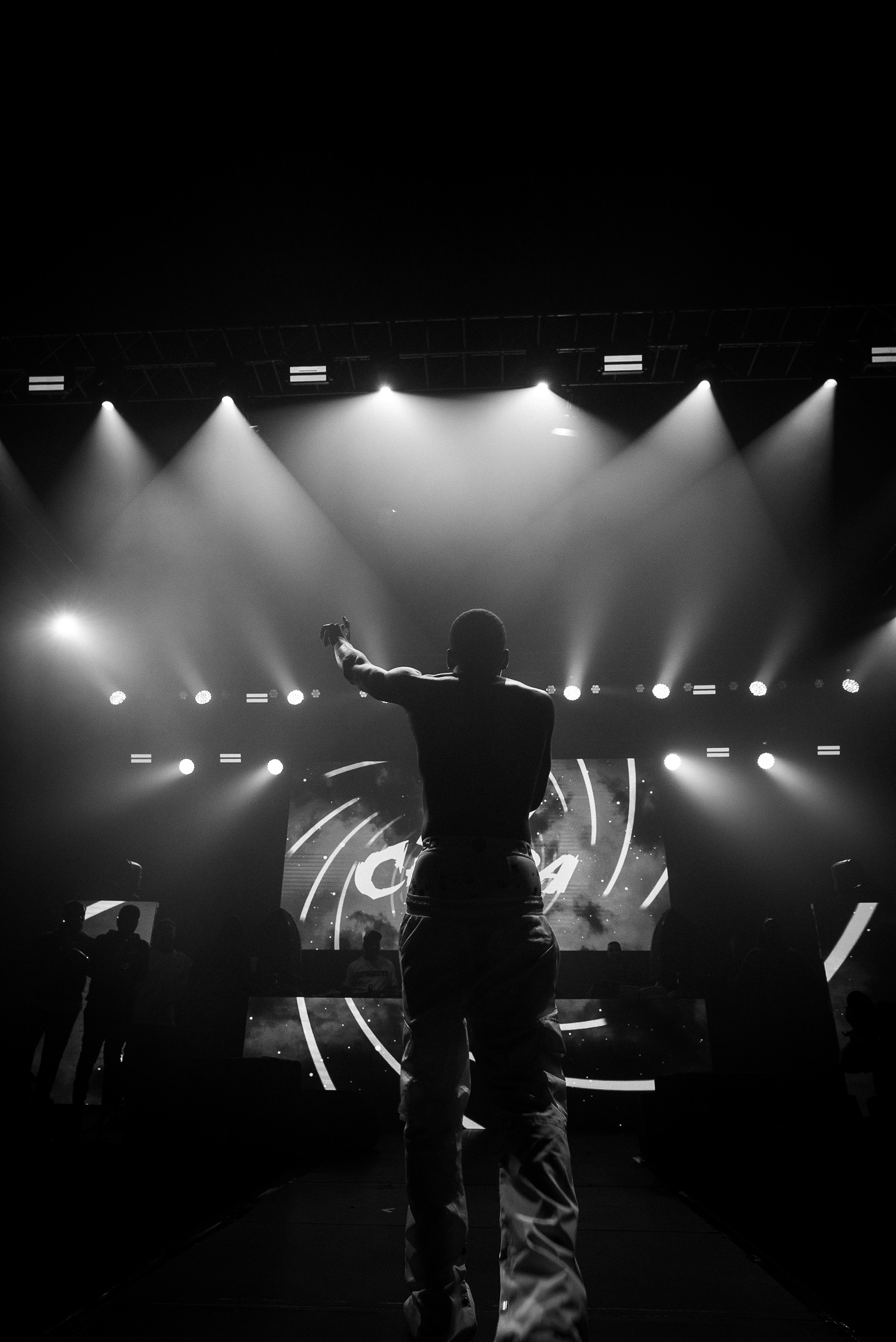 Silhouette against stage lights